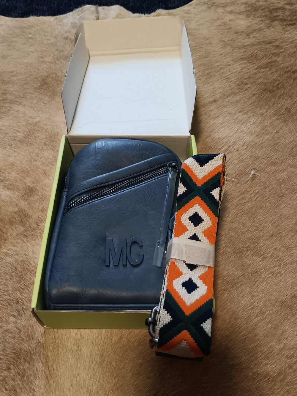 Navy Crossbody Bag with Embossed Initials and Patterned Strap